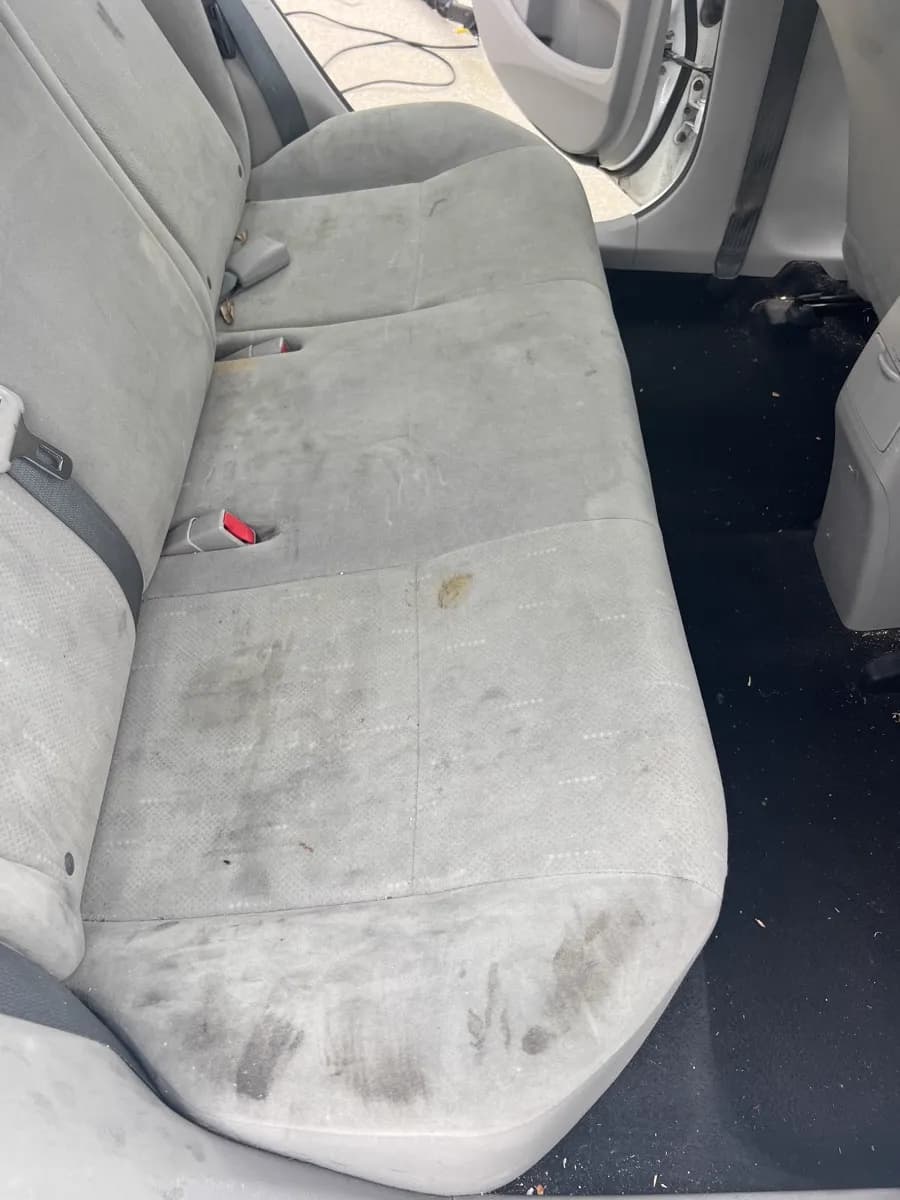 Rear seat stains and dirt — before