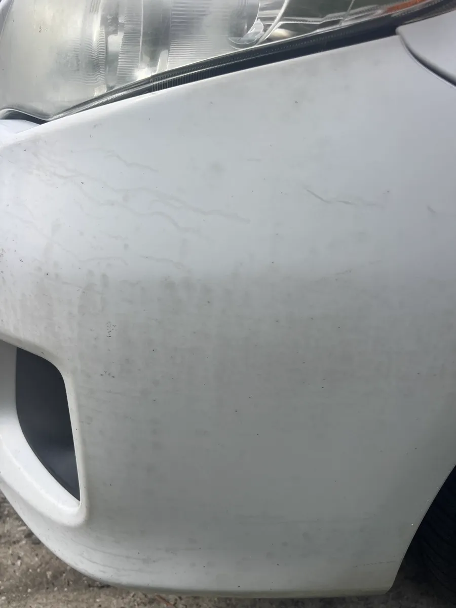Front bumper grime — before